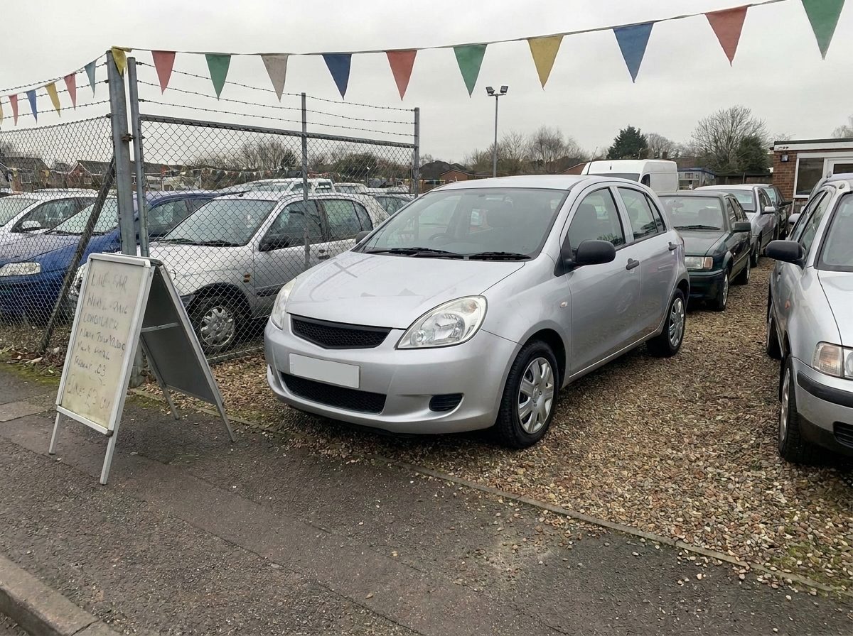 Silver hatchback on a crowded forecourt